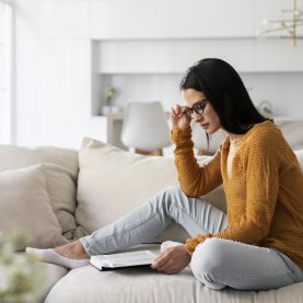 young-woman-reading-from-book-home